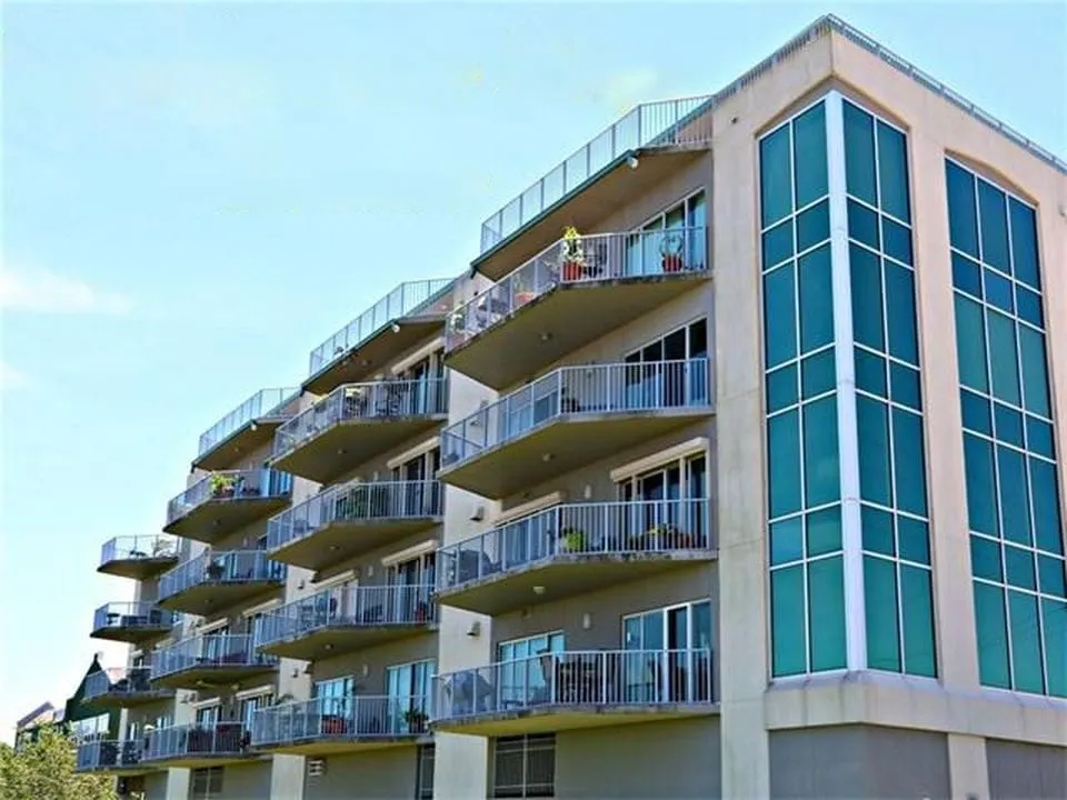 The Ridgelake condo building with glass balconies