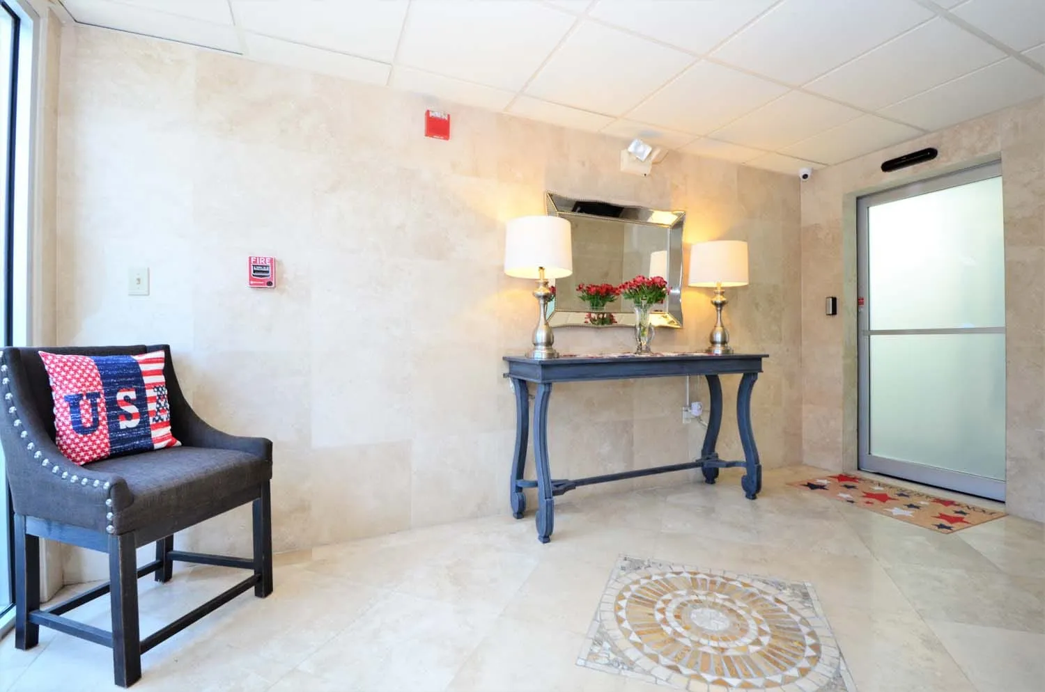 Entry with console table, bench and mosaic floor medallion