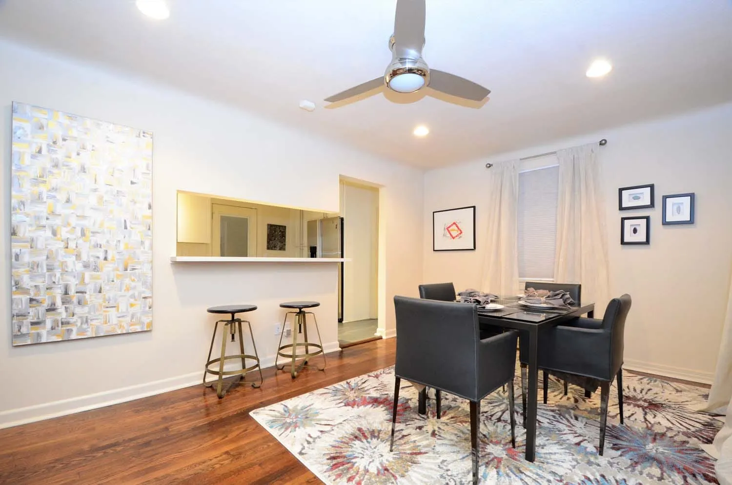 Dining area with breakfast bar and artwork