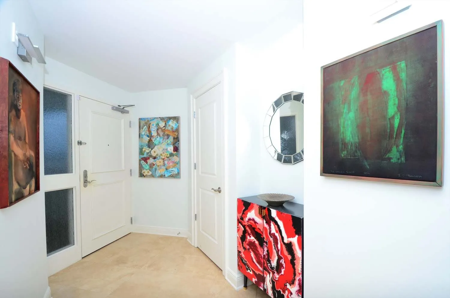 Hallway hung with colorful original art