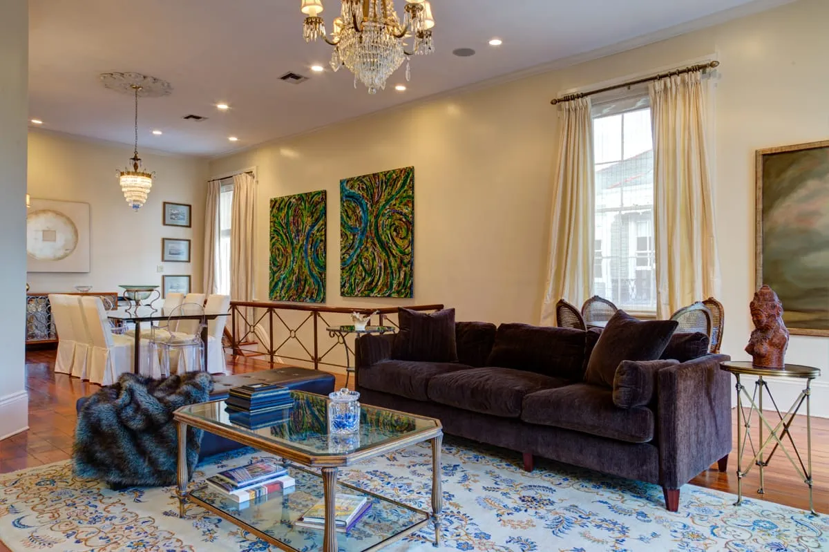 Living room at Second Street with velvet sofa and original art
