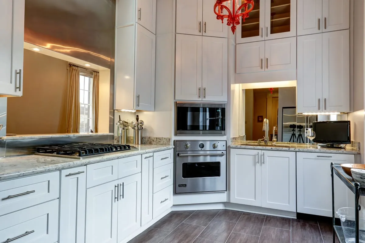 Fully equipped galley kitchen with gas cooktop and double wall ovens