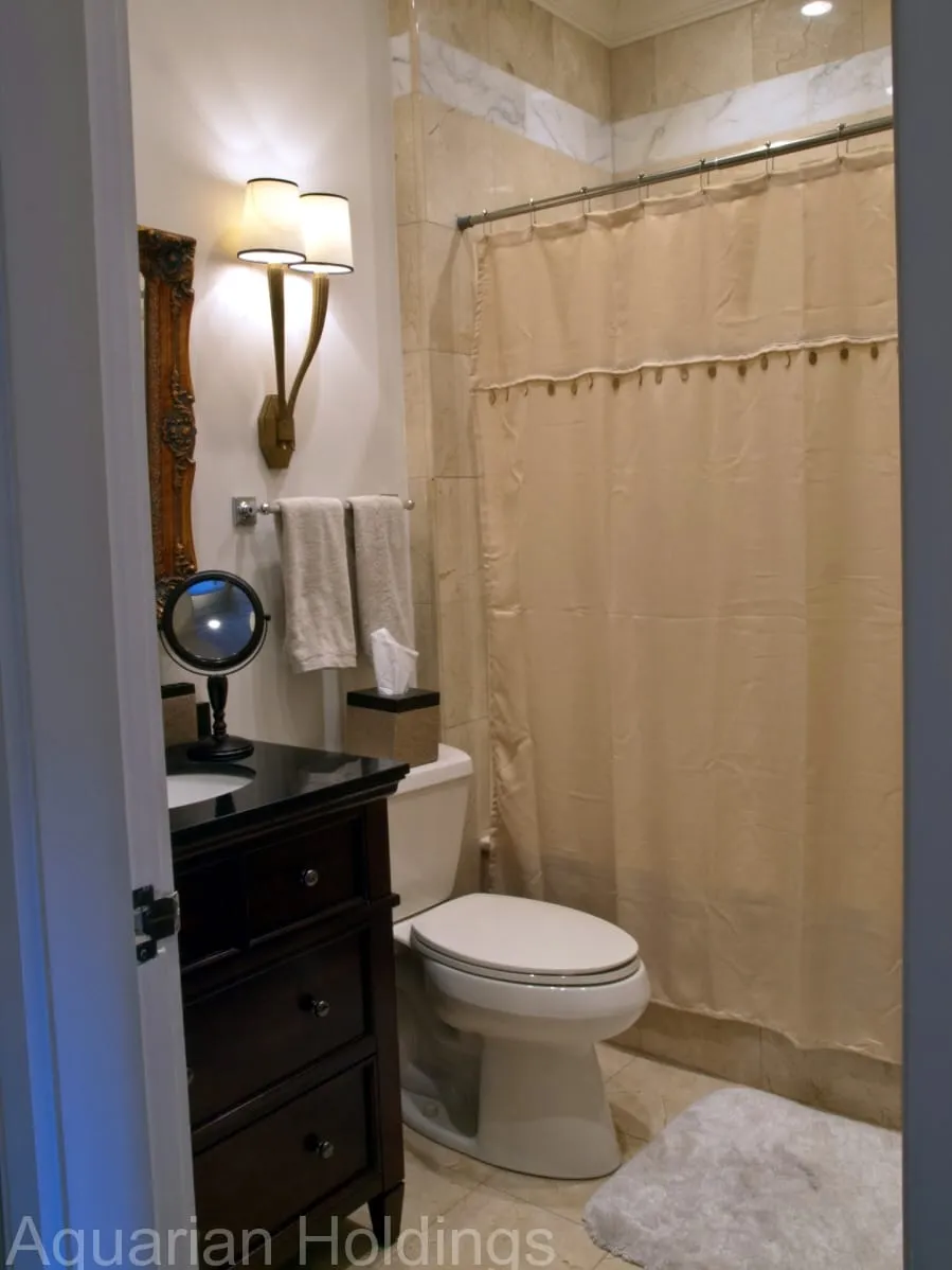 Bathroom with dark vanity and shower