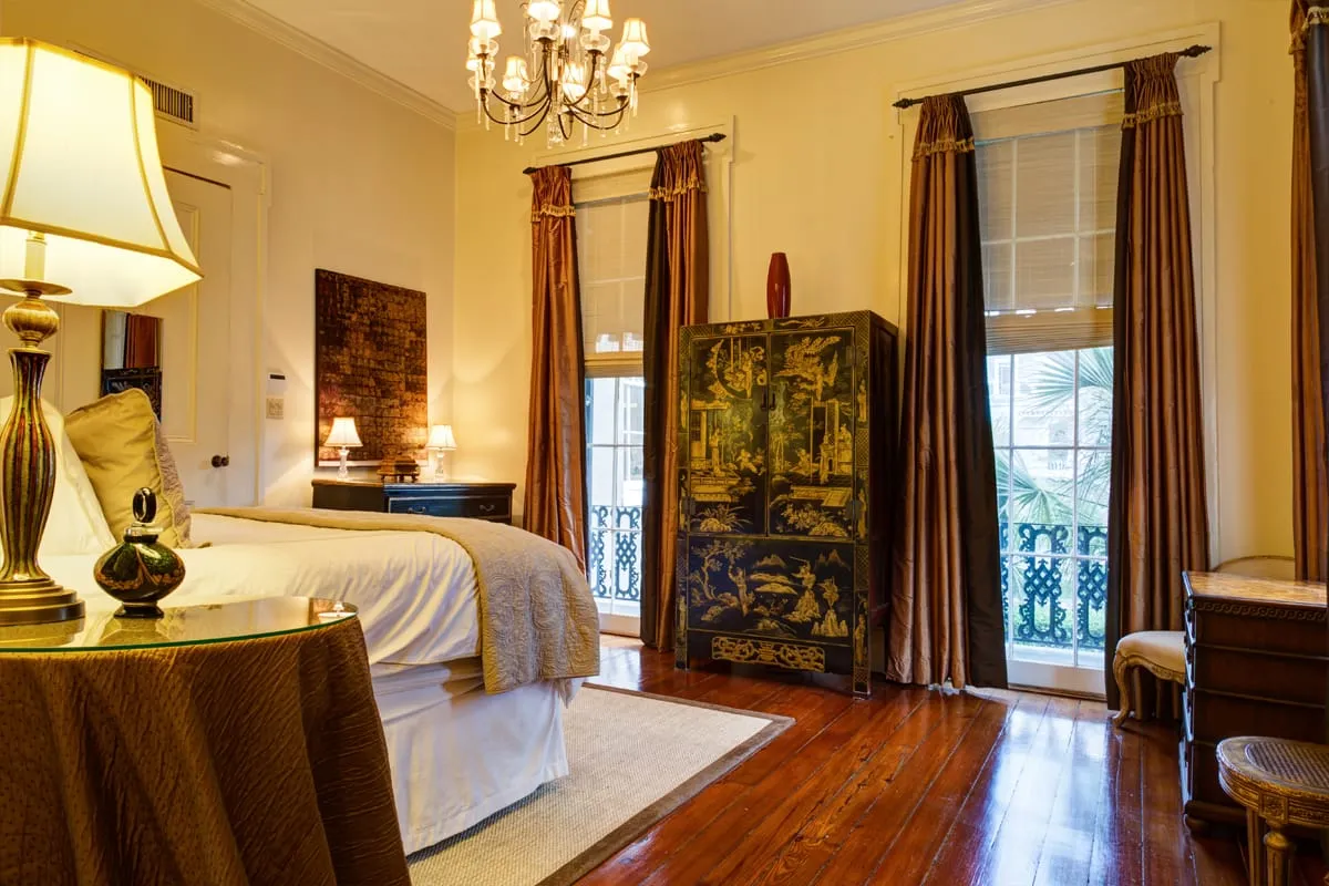Master bedroom with balcony doors overlooking the garden and pool