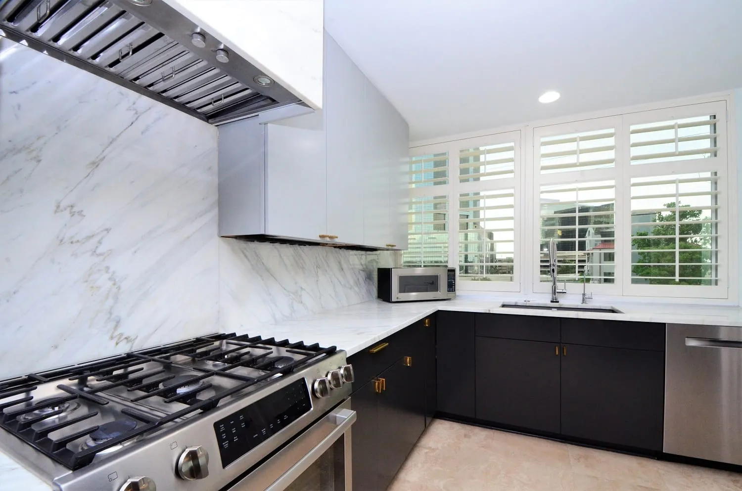 Gas range with marble surround and vent hood