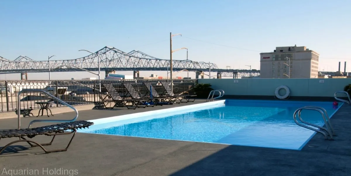 Rooftop pool with a view of the Crescent City Connection bridge