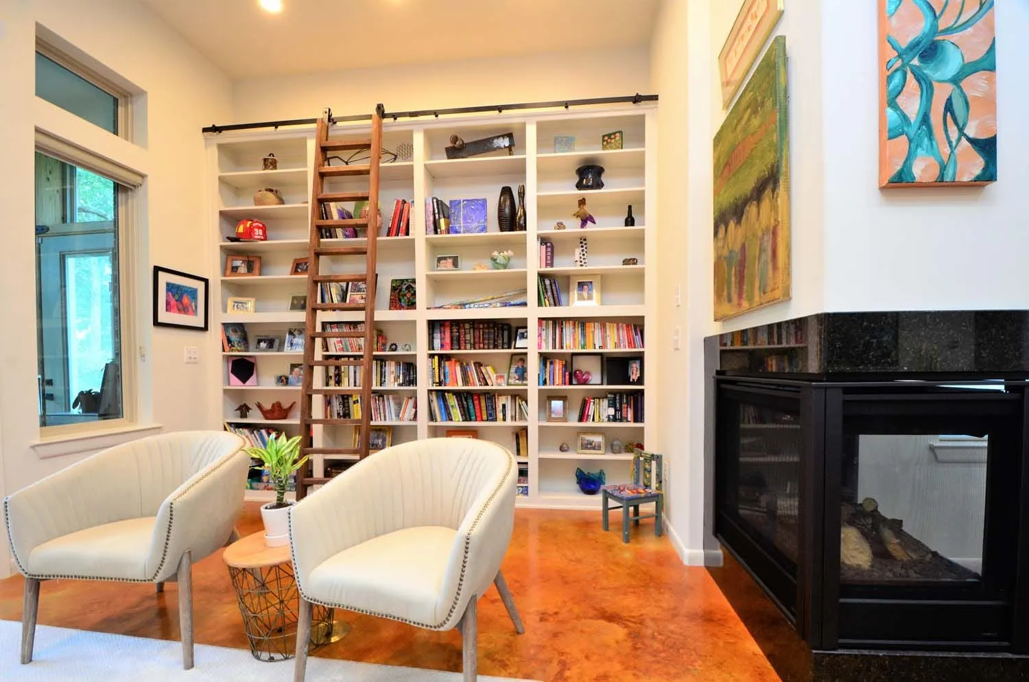 Library corner with built-in bookshelves and fireplace