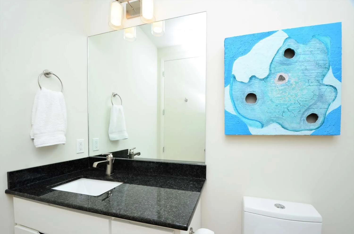 Bathroom vanity with blue original artwork