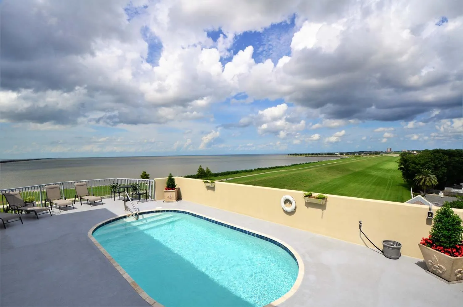View of the pool and the lake behind the building